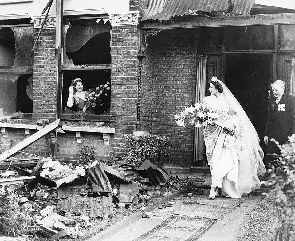 A bride leaves her recently bombed home to get married, London, 1940